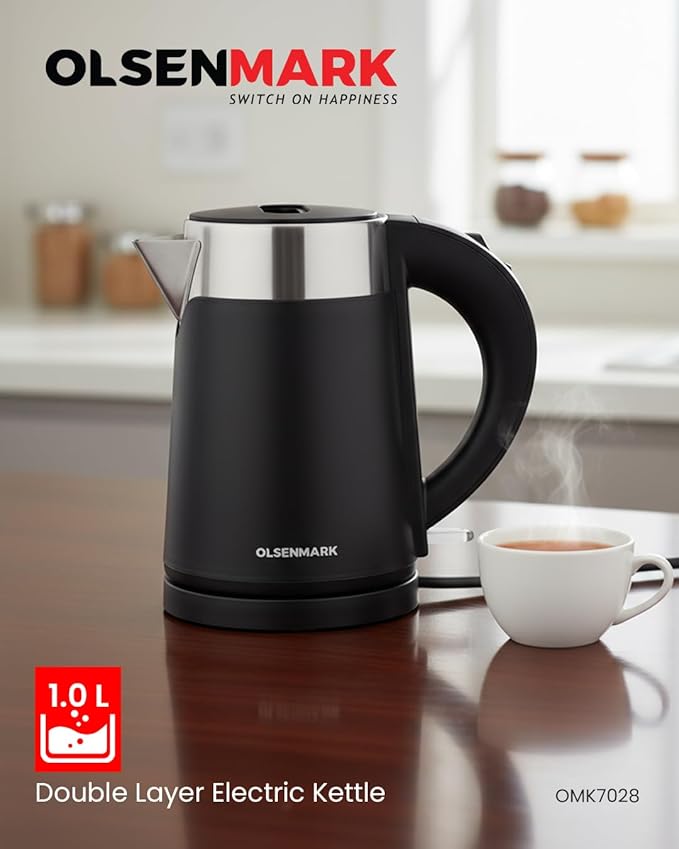 Black electric kettle with stainless steel top on a kitchen counter, featuring Olsenmark branding.
