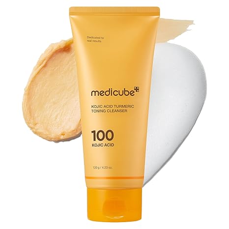 Medicube Kojic Acid Turmeric Toning Cleanser tube with a swatch of cream on a white background