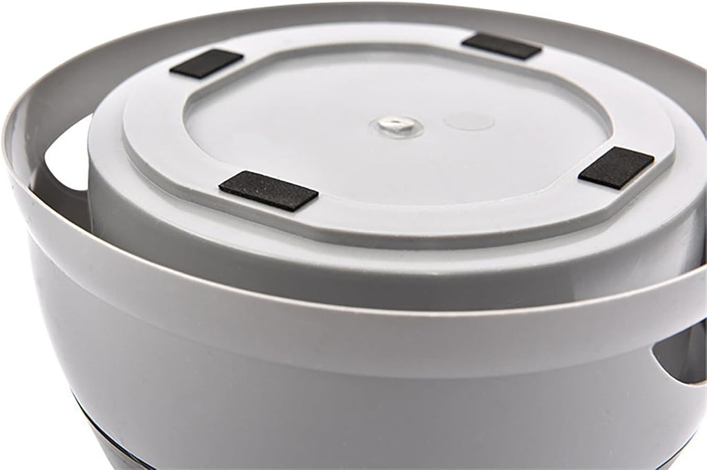 Close-up of a white electronic device with black components on a white background