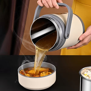 Person pouring a hot beverage from a thermos into a bowl.