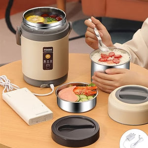 Portable food warmer with a person using it and additional containers on a table.