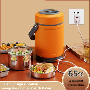 Orange electric hot pot with food on a wooden table, plugged into an outlet.