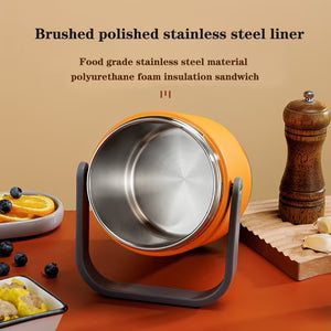 Orange metal container with a stand on a red surface, surrounded by food items.