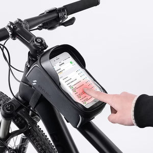 Bicycle handlebar with a smartphone mounted in a holder, showing a hand interacting with the phone.