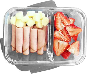Container with sliced ham, cheese, and strawberries on a white background